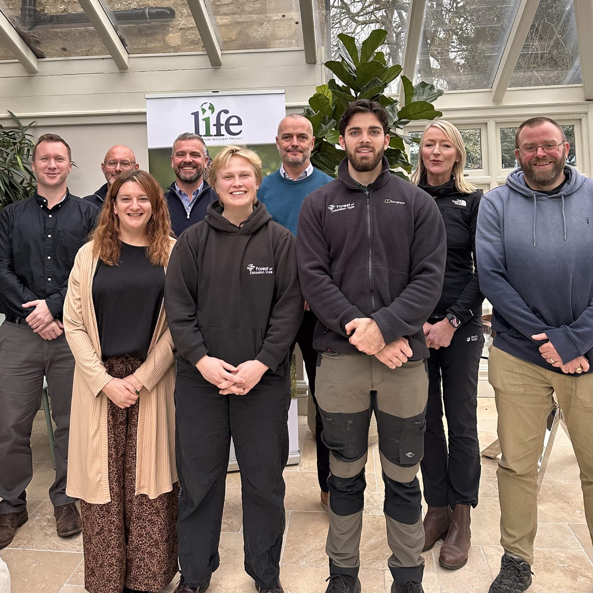 Woodland Management trainee Anthonia giving thumbs up