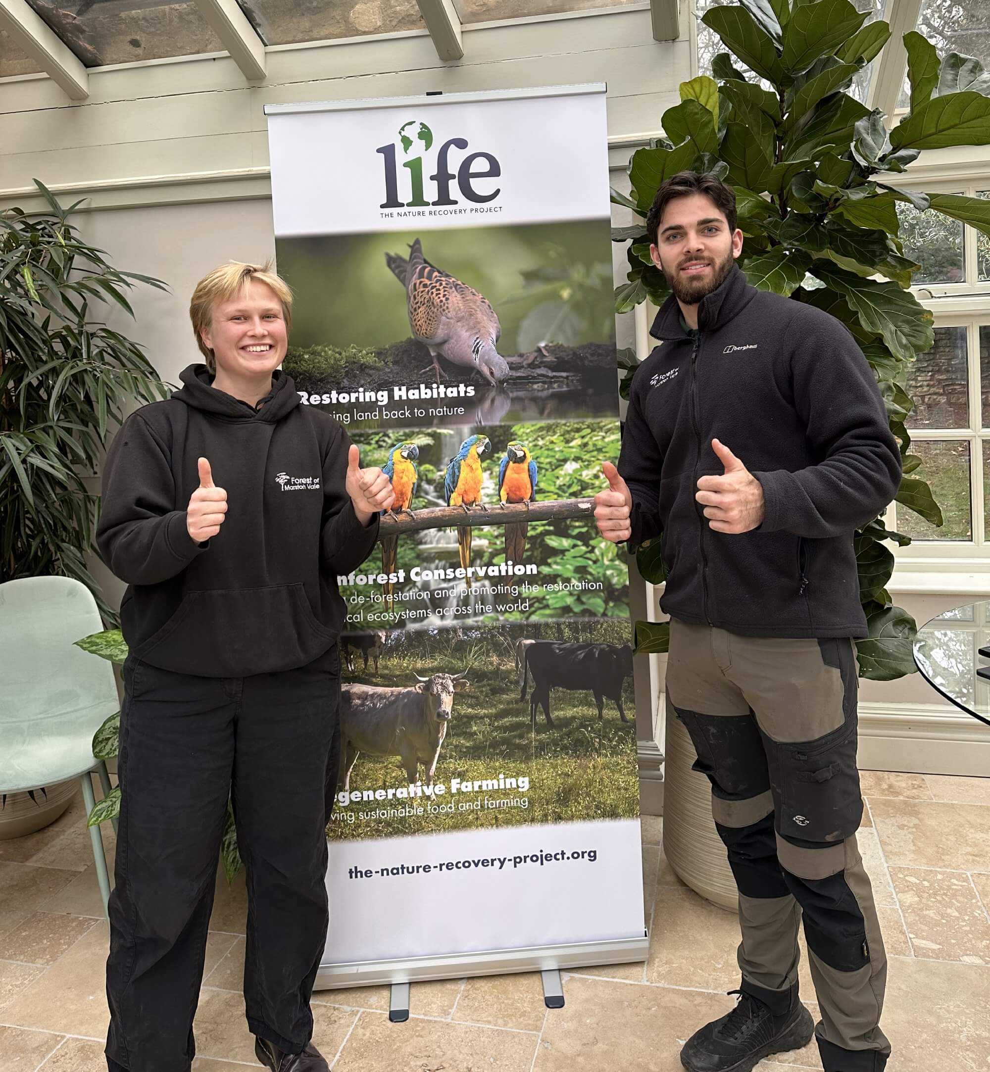 Woodland Management trainee Anthonia giving thumbs up